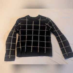 Chic Black Sweater with White Grid Pattern